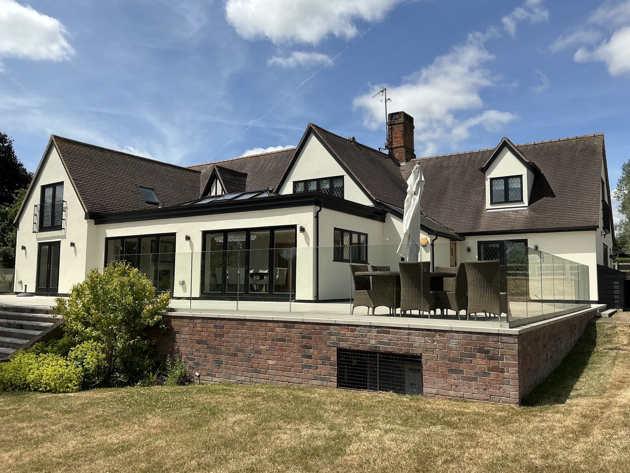 garden patio of large cream house