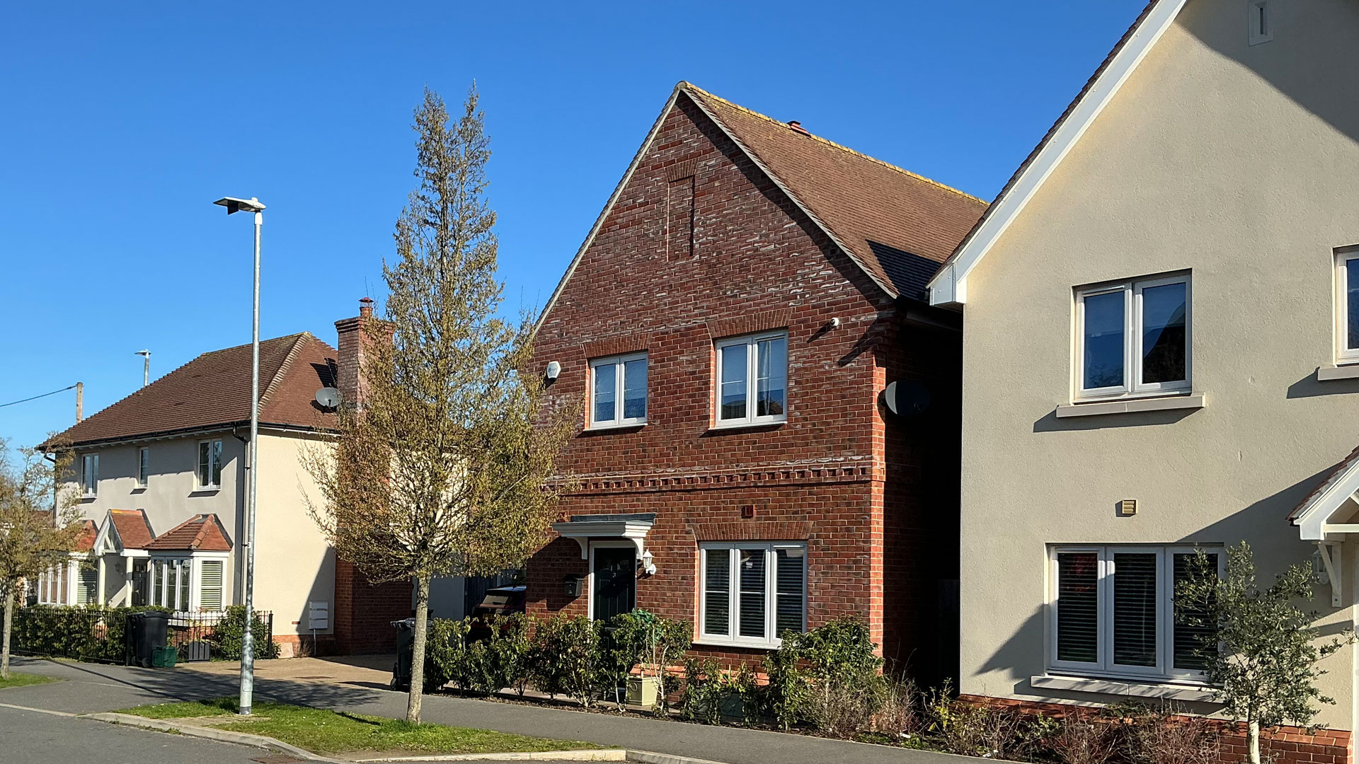 Row of detached houses on a sunny day