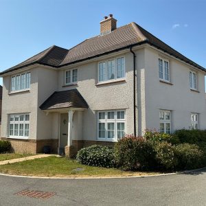cream house with garden